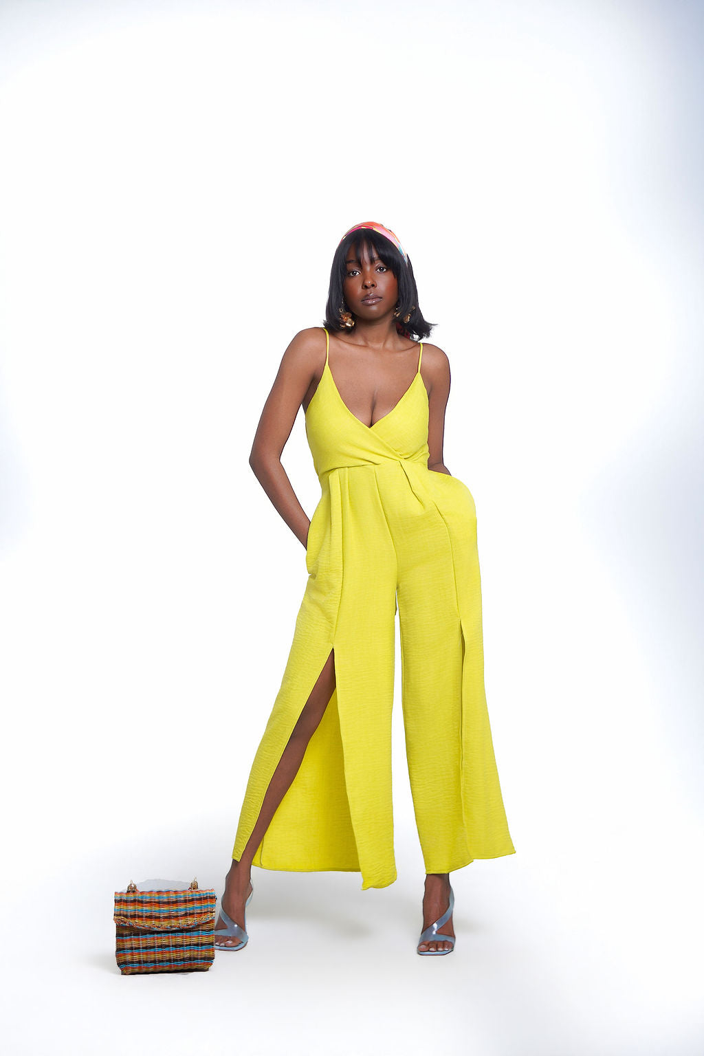 Lime Crush Jumpsuit in citrus yellow — deep V wrap neckline, spaghetti straps, wide leg with dual thigh slits and pockets